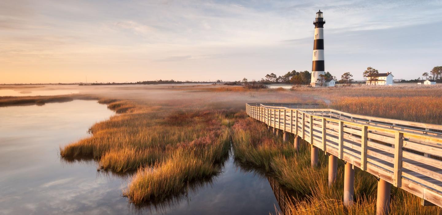 A lighthouse along the grassy plains of North Carolina.